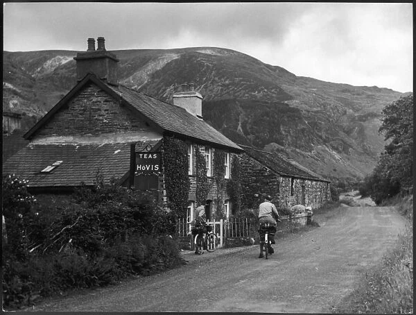 Welsh Tearooms. Two lucky cyclists contemplate whether or not to enter some tea rooms