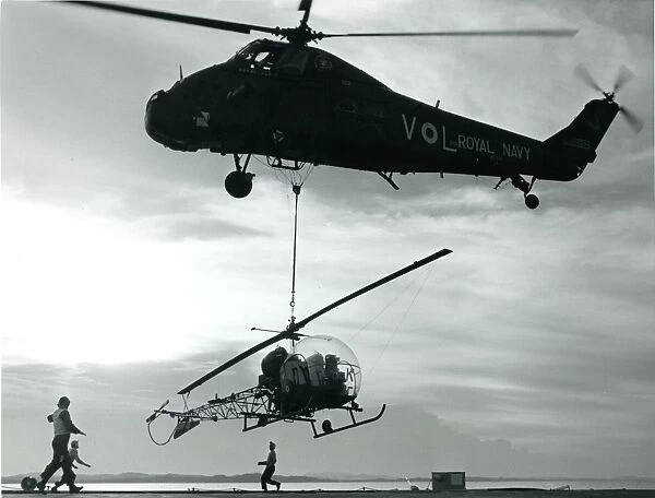A Westland Wessex HU5, XS518, lifts a Bell Sioux helicopter