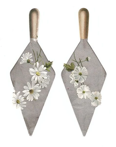 White flowers on trowels on two cutout greetings cards