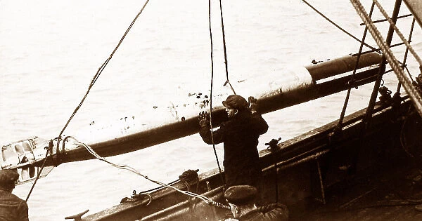 A Whitehead Torpedo being recovered probably WW1