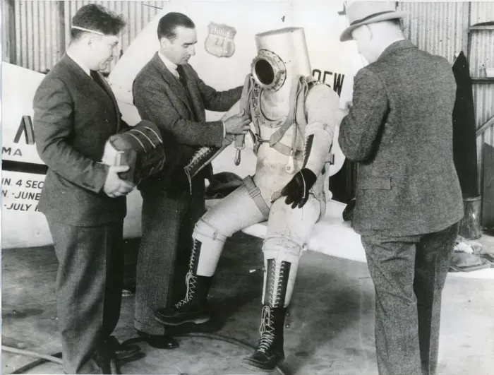 Framed Print : Wiley Post makes a final examination of his pressure suit Framed Print : Wiley Post makes a final examination of his pressure suit