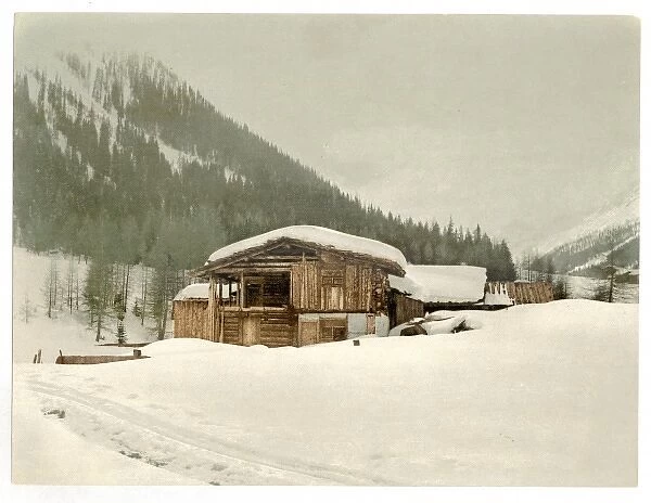 Winter scene with log structure, Grisons, Switzerland