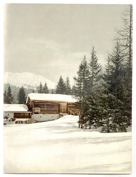Winter scene with log structure, Grisons, Switzerland