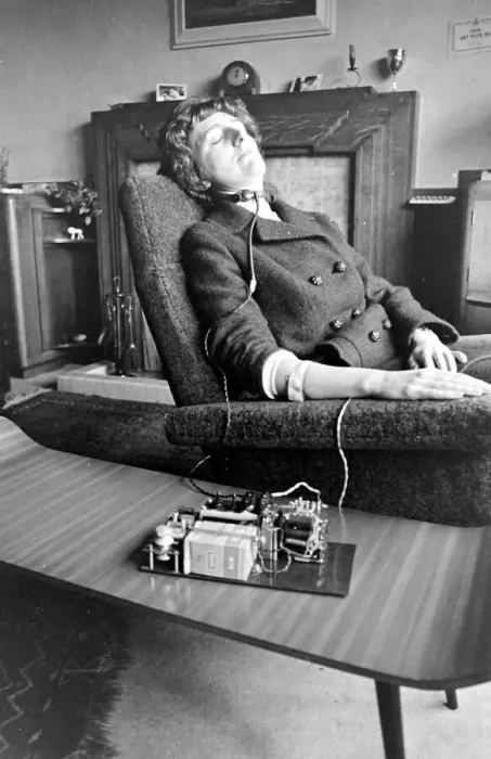 Framed Print : Woman asleep in an armchair with an anti-snoring machine attached to her Framed Print : Woman asleep in an armchair with an anti-snoring machine attached to her