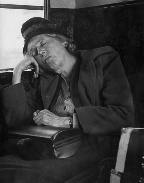 Woman asleep on a train