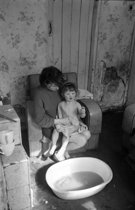 Framed Print : Woman bathing baby, Falls Road, Northern Ireland Framed Print : Woman bathing baby, Falls Road, Northern Ireland