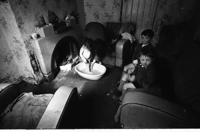 Framed Print : Woman bathing baby, Falls Road, Northern Ireland Framed Print : Woman bathing baby, Falls Road, Northern Ireland
