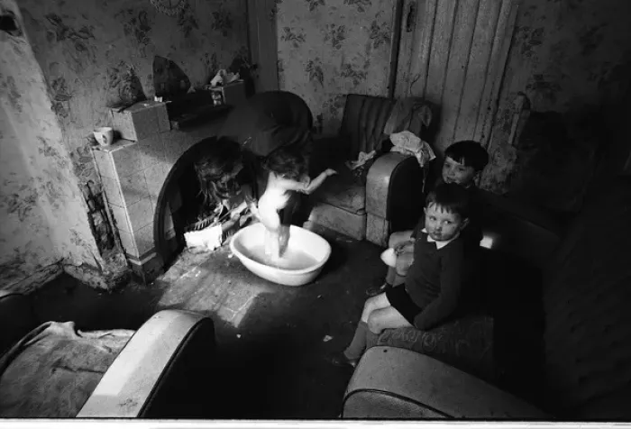 Framed Print : Woman bathing baby, Falls Road, Northern Ireland Framed Print : Woman bathing baby, Falls Road, Northern Ireland