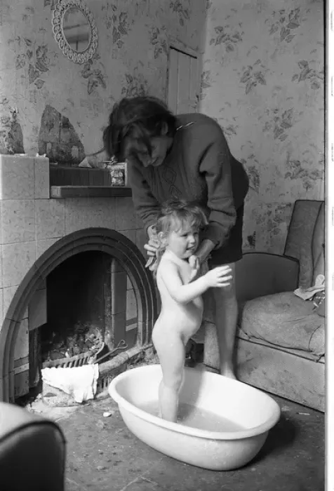 Framed Print : Woman bathing baby, Falls Road, Northern Ireland Framed Print : Woman bathing baby, Falls Road, Northern Ireland