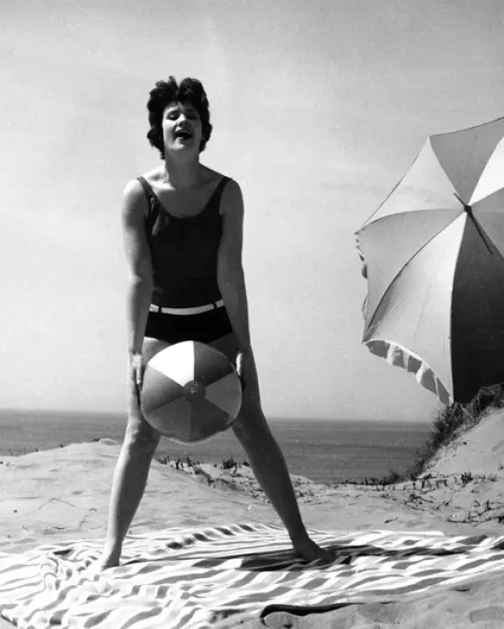 Framed Print : Woman on beach with ball and sunshade Framed Print : Woman on beach with ball and sunshade