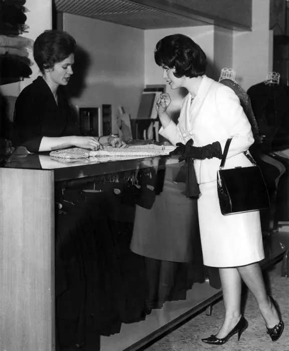 Framed Print : WOMAN BUYS KNITTED TOP Framed Print : WOMAN BUYS KNITTED TOP