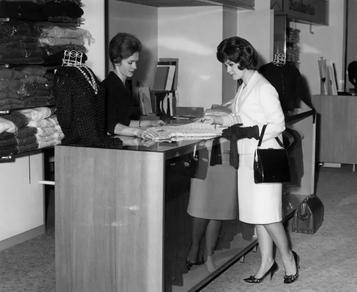 Framed Print : WOMAN BUYS KNITTED TOP Framed Print : WOMAN BUYS KNITTED TOP
