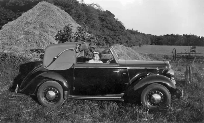 Framed Print : Woman in a car near a haystack Framed Print : Woman in a car near a haystack