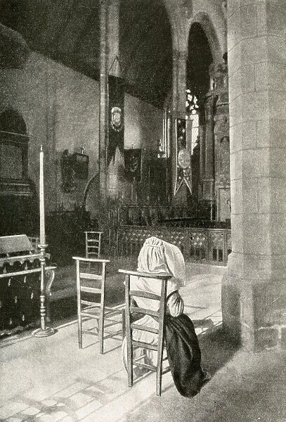 Woman in a Catholic church, Brittany, Northern France