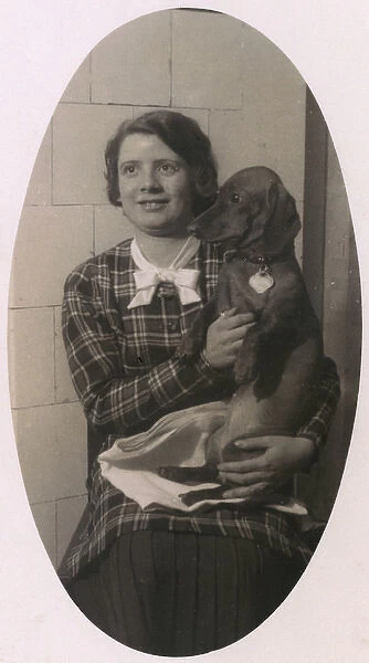 Woman with a dachshund on her lap