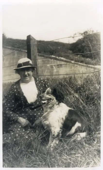 Framed Print : Woman with a dog in a field Framed Print : Woman with a dog in a field