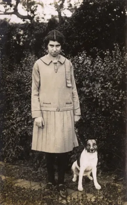 Framed Print : Woman and dog in garden Framed Print : Woman and dog in garden