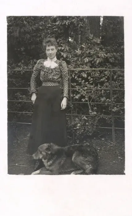 Framed Print : Woman with a dog in a garden Framed Print : Woman with a dog in a garden