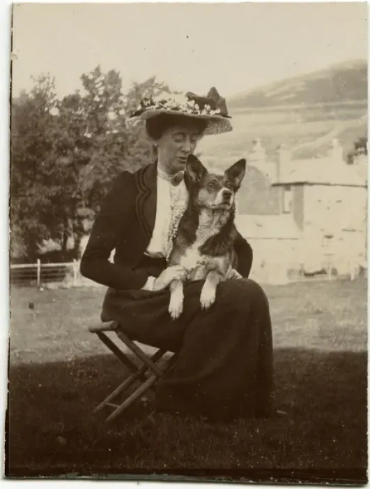 Framed Print : Woman with dog in a garden Framed Print : Woman with dog in a garden