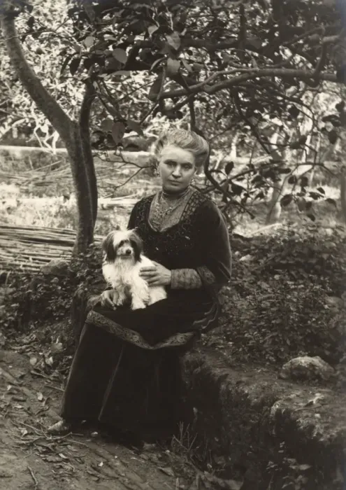 Framed Print : Woman with a dog in a garden, Italy Framed Print : Woman with a dog in a garden, Italy