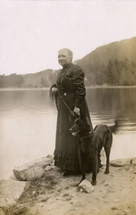 Framed Print : Woman with a dog by a lake, Vosges, France Framed Print : Woman with a dog by a lake, Vosges, France