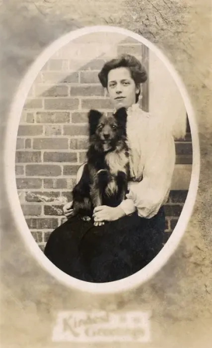 Framed Print : Woman with dog on her lap Framed Print : Woman with dog on her lap