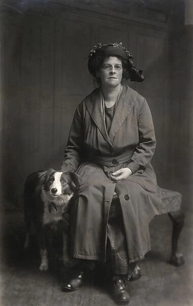 Woman with dog in studio photo
