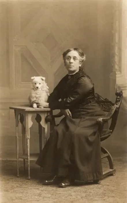 Framed Print : Woman with dog in studio photo Framed Print : Woman with dog in studio photo