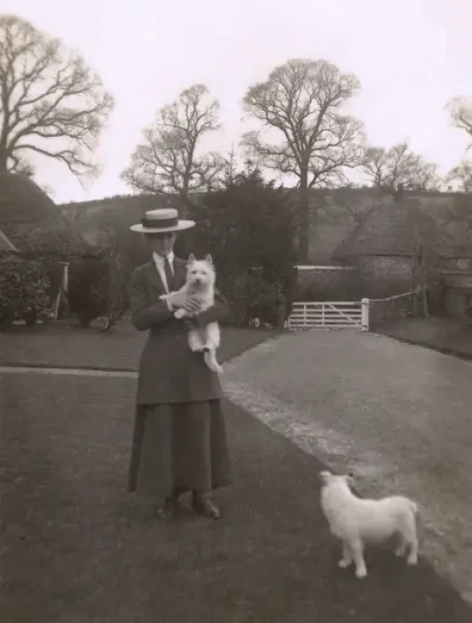 Framed Print : Woman with two dogs in a garden Framed Print : Woman with two dogs in a garden