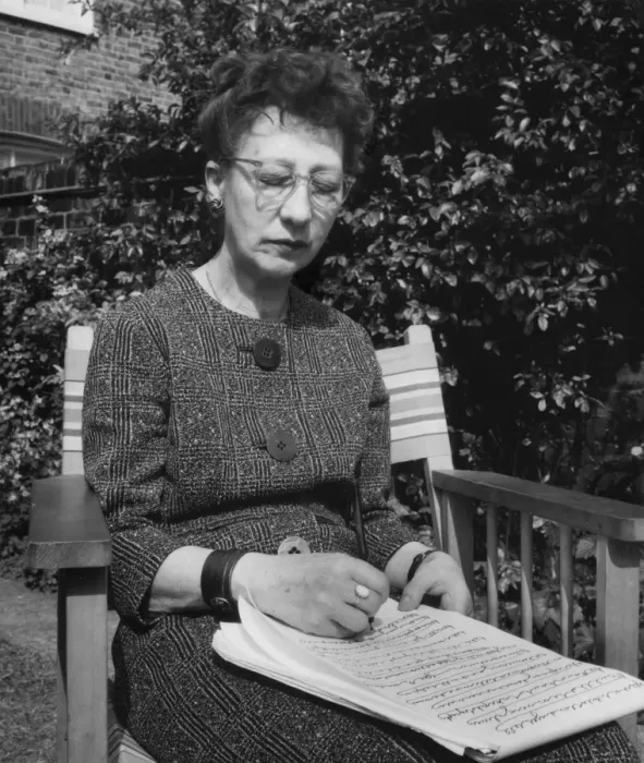 Framed Print : Woman doing automatic writing in a garden Framed Print : Woman doing automatic writing in a garden