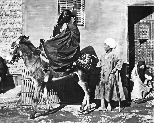 Woman on a donkey, Egypt