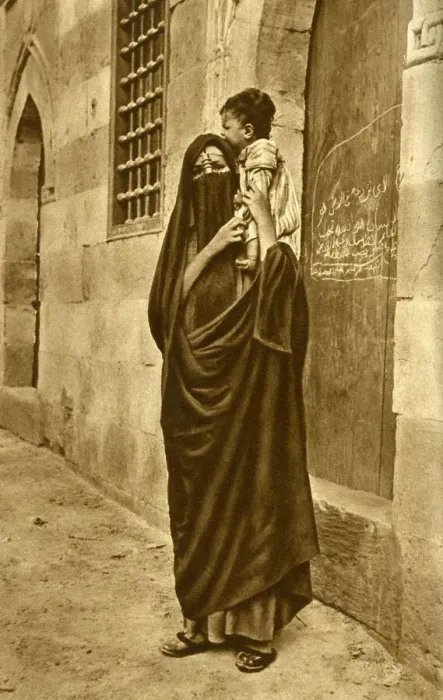 Framed Print : Woman in face veil with child on her shoulder, Cairo, Egypt Framed Print : Woman in face veil with child on her shoulder, Cairo, Egypt