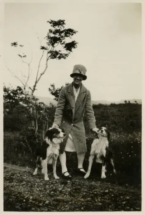 Framed Print : Woman in a garden with two collie dogs Framed Print : Woman in a garden with two collie dogs