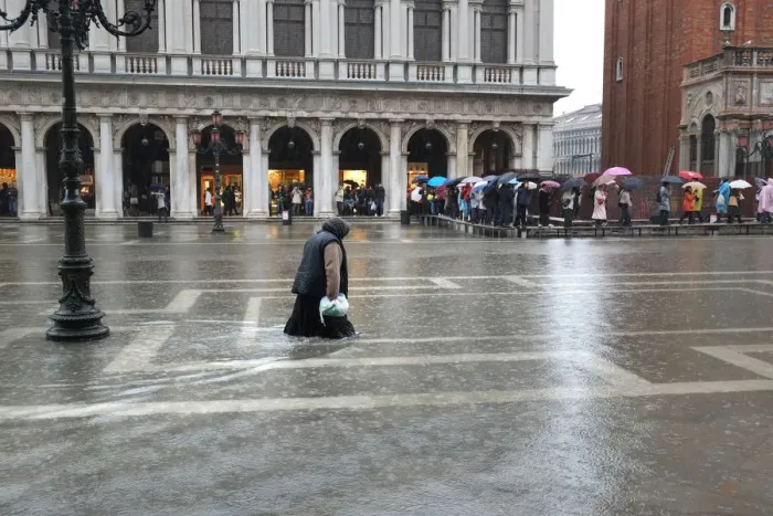 Framed Print : Woman gives up trying to keep dry - floods, Venice Framed Print : Woman gives up trying to keep dry - floods, Venice