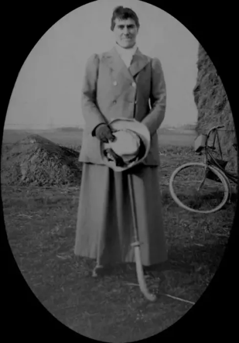 Framed Print : Woman with hockey stick, bicycle and hay rick Framed Print : Woman with hockey stick, bicycle and hay rick