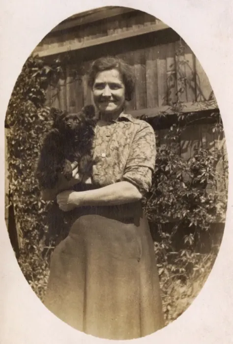 Framed Print : Woman holds her dog Framed Print : Woman holds her dog