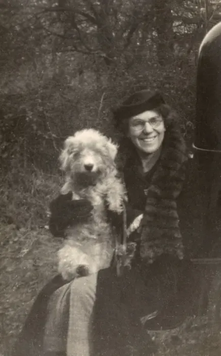 Framed Print : Woman holds her dog Framed Print : Woman holds her dog