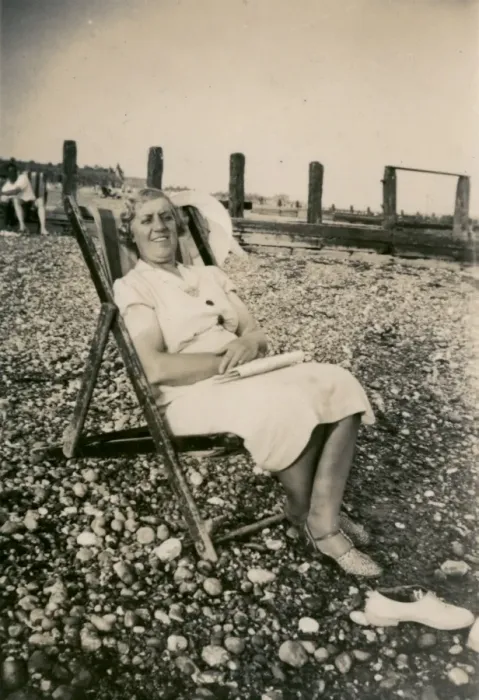 Framed Print : Woman on holiday, sitting in a deckchair Framed Print : Woman on holiday, sitting in a deckchair