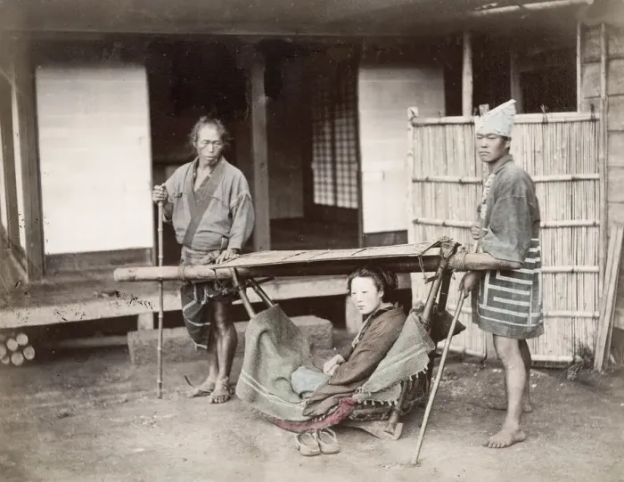 Framed Print : Woman in a kago, carrying chair with porters, Japan
