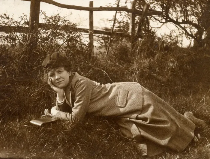 Framed Print : Woman lying on grass in a field Framed Print : Woman lying on grass in a field