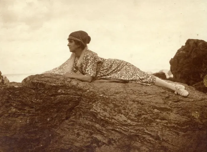Framed Print : Woman lying on a rock at the seaside Framed Print : Woman lying on a rock at the seaside