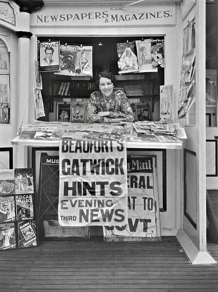 Woman in newspaper kiosk