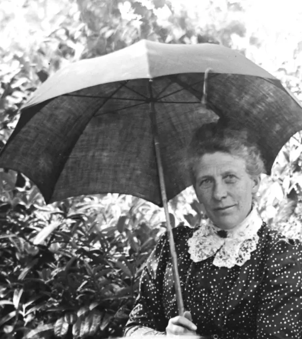 Framed Print : Woman with a parasol in a garden Framed Print : Woman with a parasol in a garden