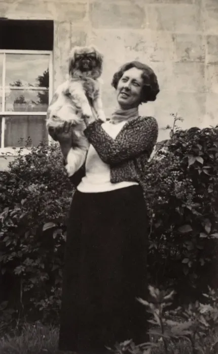 Framed Print : Woman with Pekingese dog in a garden Framed Print : Woman with Pekingese dog in a garden