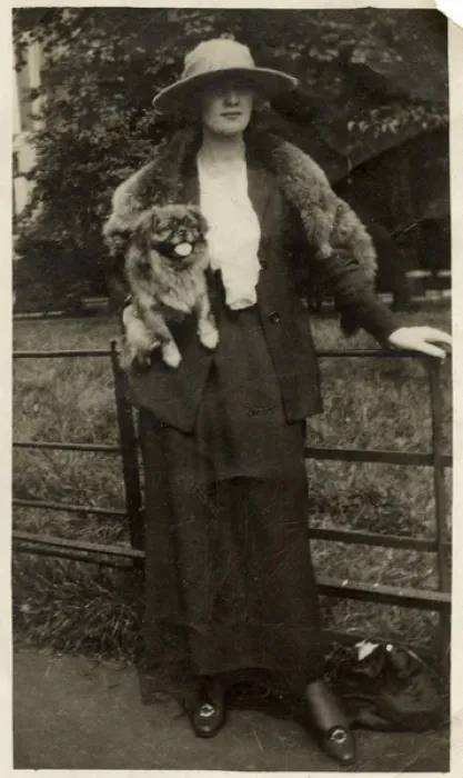 Framed Print : Woman with Pekingese dog in a park Framed Print : Woman with Pekingese dog in a park