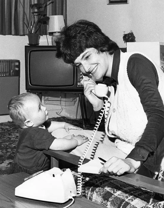 Framed Print : Woman on the phone, with toddler Framed Print : Woman on the phone, with toddler