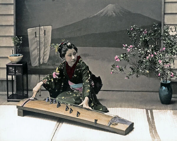 Woman playing a Koto, Japan