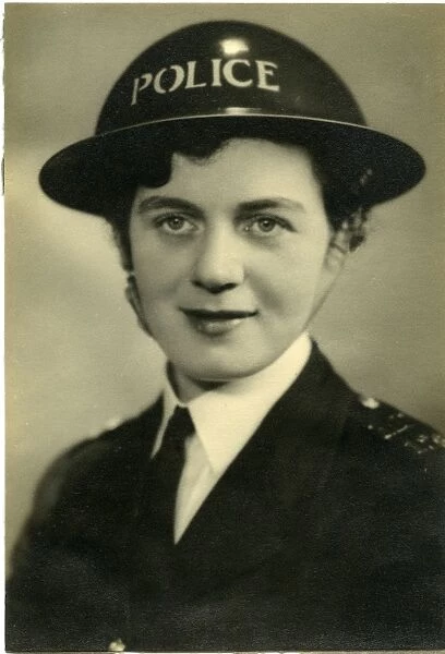 Woman police officer in air raid helmet, London, WW2