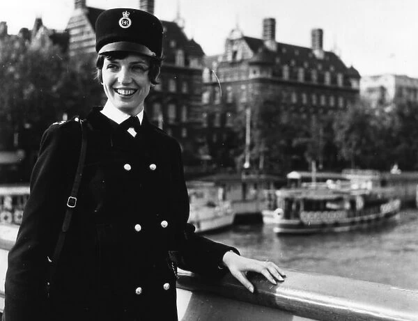 Woman police officer on a bridge, London