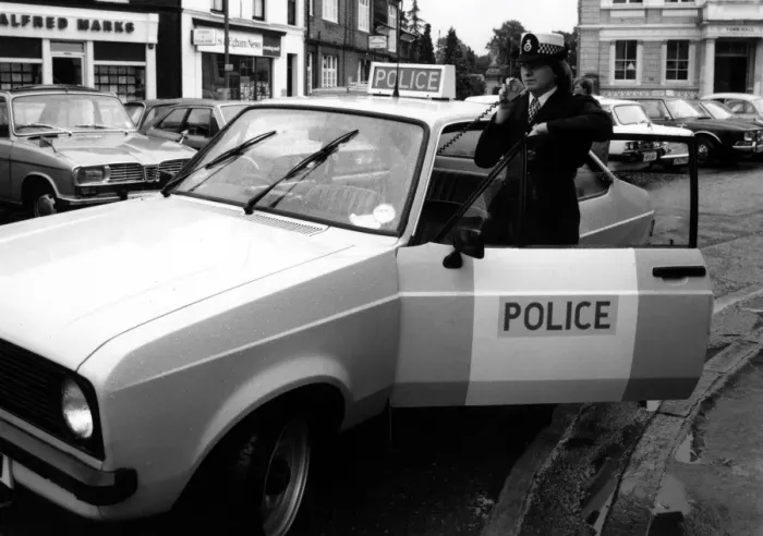 Framed Print : Woman police officer with car and radio, Egham, Surrey Framed Print : Woman police officer with car and radio, Egham, Surrey